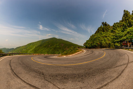 Hai Van pass - the famous road which leads along the coastline mountains near Da Nang city, Vietnam. Beautiful nature and transportation background.の写真素材