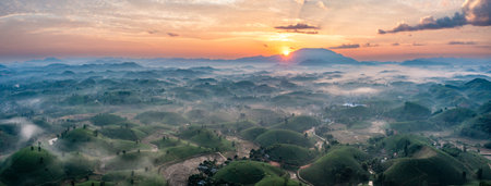 Aerial view of tea plantation and sunrise at Long Coc tea hill, Phu Tho province, Vietnamの写真素材