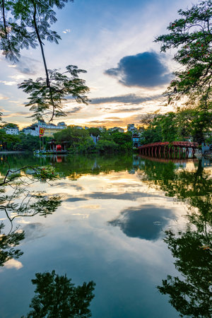 View of red bridge or The Huc Bridge in Hoan Kiem Lake, this is a lake in the historical center of Hanoi, the capital city of Vietnam.の写真素材