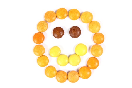 Happy chocolate face made with yellow candyの写真素材