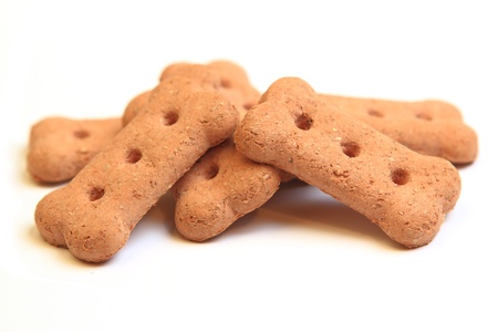 Brown dog biscuits on a white backgroundの写真素材