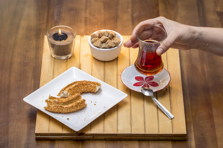 Turkish bagel, simit with Turkish tea on wood table  - Stock Imageの写真素材