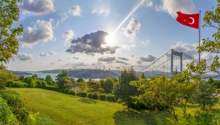 View of the Turkish Flag and the Fatih Sultan Mehmet Bridge photo taken from Otagtepe, Istanbulの写真素材