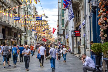 Istanbul, Turkey June 15, 2019: Nostalgic Red Tram in Taksim Istiklal Street at evening. Taksim...