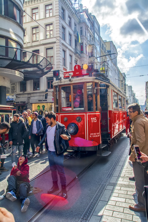 Taksim, Istanbul, Turkey - August 19, 2019: Taksim Istiklal Street is a popular tourist destination and Retro tram moves along a busy Istiklal street in Istanbul.のeditorial素材
