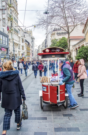 Taksim, Istanbul, Turkey - August 19, 2019: Taksim Istiklal Street is a popular tourist destination and Retro tram moves along a busy Istiklal street in Istanbul.のeditorial素材