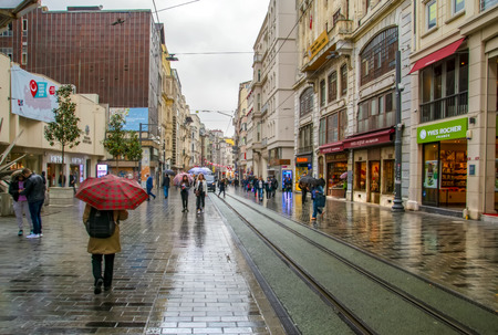Taksim, Istanbul, Turkey - August 19, 2019: Taksim Istiklal Street is a popular tourist destination and Retro tram moves along a busy Istiklal street in Istanbul.のeditorial素材