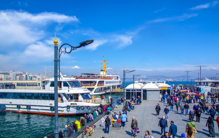 Istanbul, Turkey June 13, 2019: Muslim architecture and water transport in Turkey - Beautiful View touristic landmarks from Bosphorus. Cityscape of Istanbul at sunset - old mosque and turkish steamboats, view on Golden Horn.のeditorial素材
