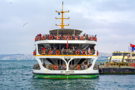 Istanbul, Turkey June 13, 2019: Muslim architecture and water transport in Turkey - Beautiful View touristic landmarks from Bosphorus. Cityscape of Istanbul at sunset - old mosque and turkish steamboats, view on Golden Horn.のeditorial素材