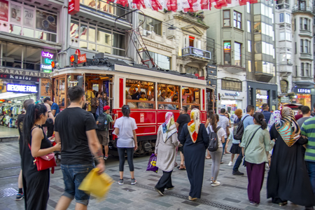 Taksim Istanbul, Turkey August 19, 2019: Nostalgic Red Tram in Taksim Istiklal Street at evening. Taksim Istiklal Street is a popular destination in Istanbul. Beyoglu, Taksim, Istanbul. Turkey.のeditorial素材