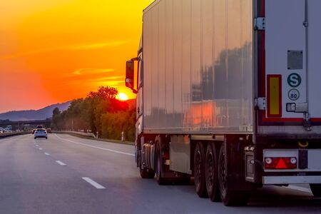 Truck with container on highway, cargo transportation concept.の写真素材