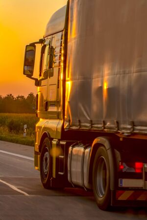 Truck with container on highway, cargo transportation concept.の写真素材
