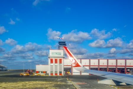ISTANBUL TURKEY - AUGUST 09, 2019: Wing of Turkish Airlines plane during landing to Istanbul Airport. View from the planeのeditorial素材