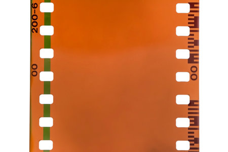 Close-up of a film strip on a white background with copy spaceの写真素材