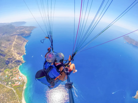 Paraglider on the background of the sea and blue sky
