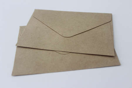 Two pieces of craft paper envelope on white background