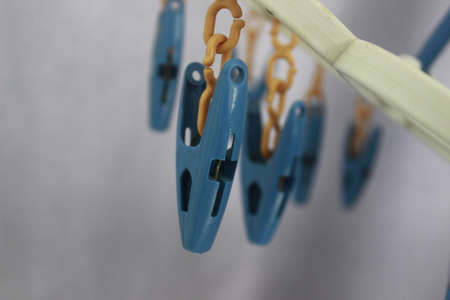 Hanging Clothespins with backgroundの写真素材