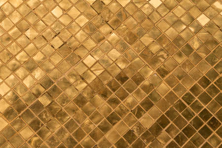 A golden tiles of a golden stupa in Wat Phra Kaew, Thailandの写真素材