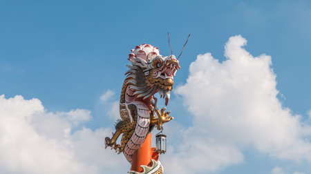 Chinese dragon on the red pole at Wat Phananchoeng, Ayutthaya, Thailandの写真素材