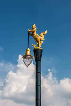 Golden swan lamp and wind bell in templeの写真素材