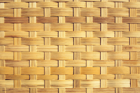 woven bamboo surface in the sunlight backgroundの写真素材