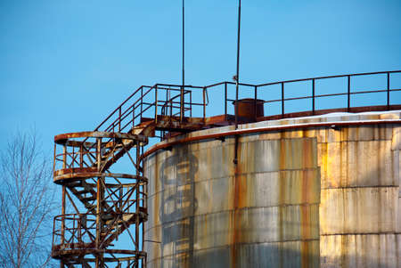 Old storage tank and staircase closeupの写真素材