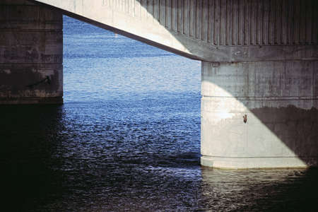 Bridge support close-up with interesting light, shadows and compositionの写真素材
