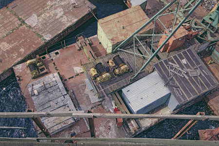 Old abandoned pier with loaders from an interesting angle of viewの写真素材