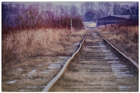 Photo in retro style picturesque abandoned old railwayの写真素材