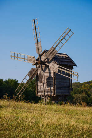 The photo shows a typical windmill of medieval Ukraine of the 16th and 17th centuries. Photo taken at the National Museum of Folk Architecture and Life of Ukraine Pirogovo, Kiev, Ukraine - August 30, 2018のeditorial素材