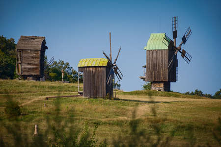 Three windmills on picturesque hillsの写真素材