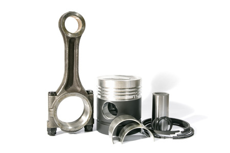 photo a set a piston rod the ring piston on a white background
