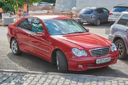 Krasnoyarsk, Russia - August 15, 2018: Mercedes Benz C 320 car is parked at new bank branch. Front right view.のeditorial素材