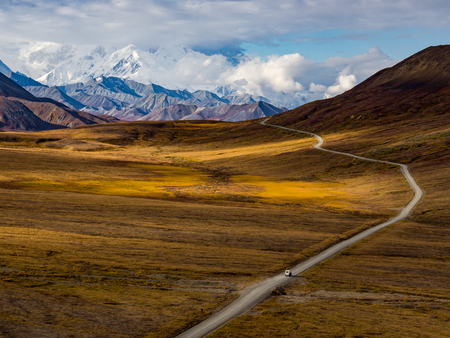 Sunlight on Autumn Tundra, Snowy Mountains, Denali National Parkの写真素材