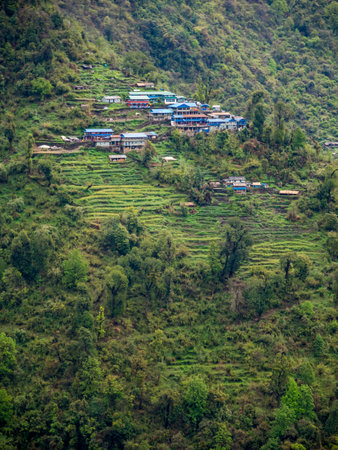Nepal Village on Mountain Slope, Chhomrong, Annapurna Region, Terrace Rural Mountain Villageの写真素材