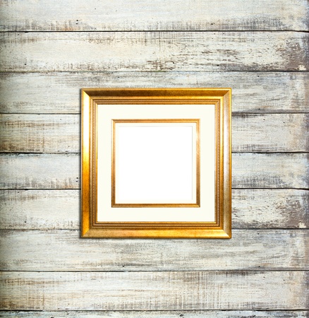Gold Vintage picture frame, wood plated, old wood backgroundの写真素材