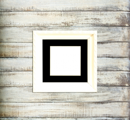White Vintage picture frame, wood plated, old wood backgroundの写真素材