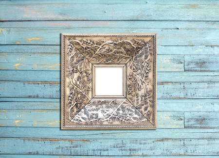 Silver Vintage picture frame, wood plated, blue wood background, clipping path includedの写真素材
