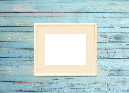 Vintage picture frame, wood plated, blue wood background, clipping path includedの写真素材