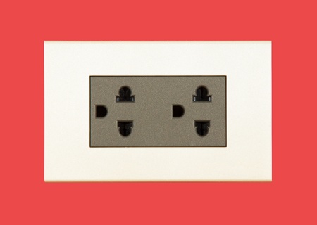 Plug  socket on red background