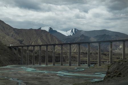 Snow mountain and bridge on plateauの写真素材
