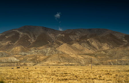 Mountains and land under clear skyの写真素材