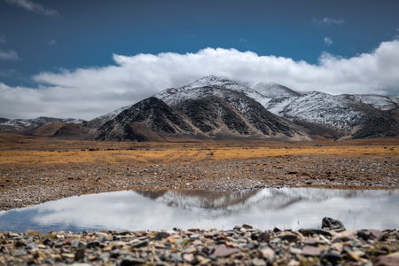 Snow mountain plateau in cloudy weather.の写真素材