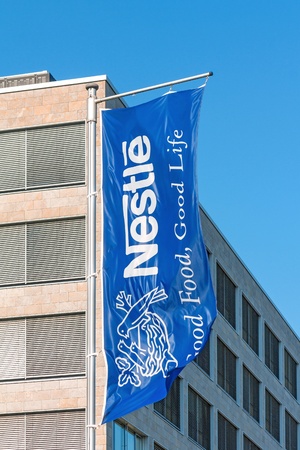 Frankfurt, Germany - July 7, 2013  Blue company flag of Swiss multinational food and beverage company Nestle S A のeditorial素材