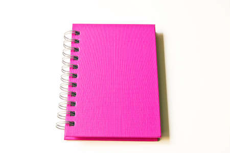 pink notebook isolatedの写真素材