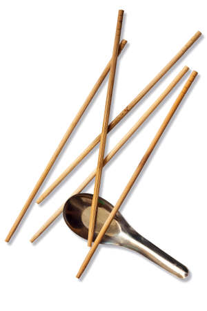 spoon and chopsticks isolated on whiteの写真素材