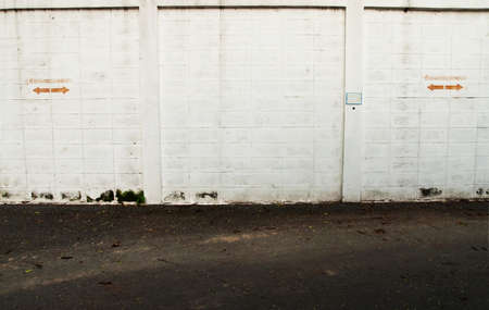 Grunge white wall in car parkの写真素材