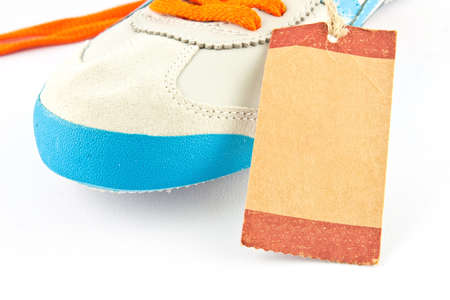 Paper tage of shoe isolated on whiteの写真素材