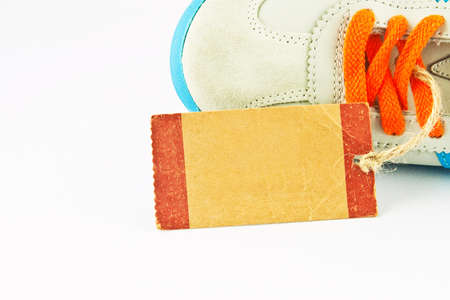 Paper tage of shoe isolated on whiteの写真素材