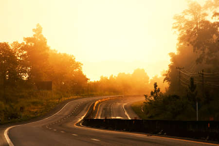 Curve road in morning sunshineの写真素材